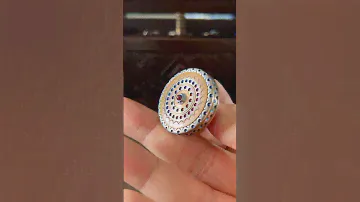 Titanium, bronze precision spinning top with ruby ball bearing